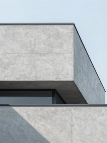 Minimalist modern architectural concrete facade with sharp geometric shadows, bright overcast daylight, cool blue tones, clean lines