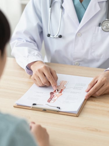Close-up of a doctor's hands gently explaining a clean medical diagram to a patient on a wooden desk, soft natural light, warm professional atmosphere