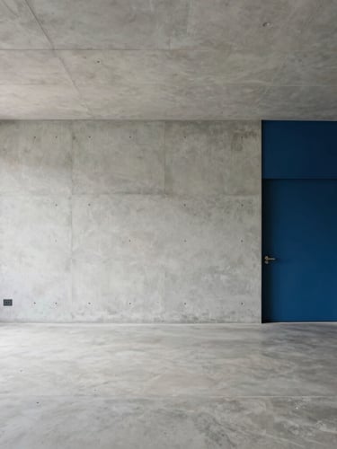 Wide architectural shot of a modern clean concrete workspace in Hyderabad, soft natural daylight, minimalist lines, 35mm