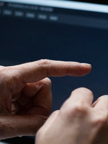 Extreme macro detail of hands interacting with a clean software interface, cool daylight, high-contrast shadows, 35mm