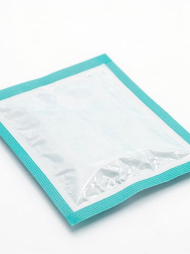 Clean clinical veterinary medicine packaging on a sterile white surface with soft teal accents, sharp focus, 50mm lens