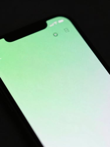 Macro shot of an Android phone screen displaying a smooth UI animation, with subtle neon green glow, dark studio background, sharp focus.
