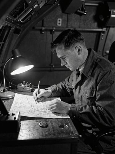 Archival monochrome photograph of a WWII RAF navigator at his desk inside a Lancaster bomber, focused on a map under a small desk lamp, deep shadows, vintage film grain.