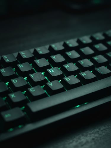 Moody close-up of a high-end mechanical keyboard on a dark desk, glowing emerald green LED backlight, shallow depth of field, sharp macro focus