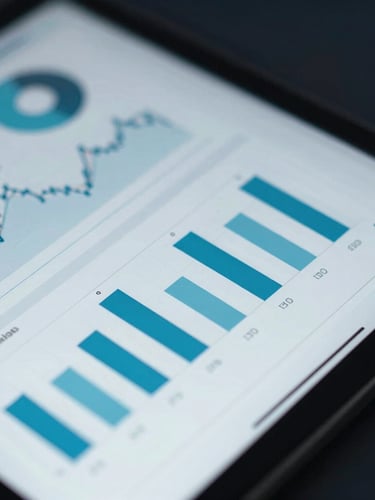 Close-up macro shot of a tablet displaying complex financial analytics and charts, cool silver and cyan reflections, professional executive setting