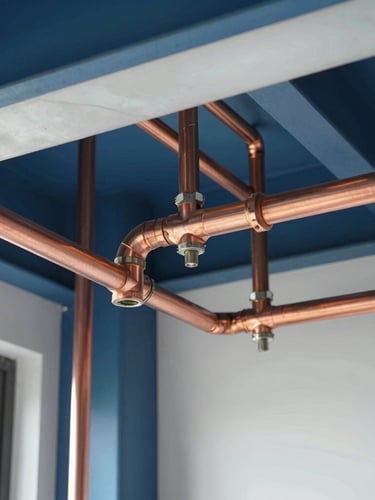 Macro detail shot of clean, precise copper pipework and organized HVAC ducting installations in a modern building utility room, bright crisp daylight, professional engineering precision, editorial 35mm