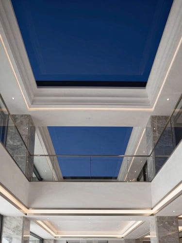 A crisp vertical architectural shot of a luxury Dubai villa interior, showcasing a flawless suspended gypsum ceiling with integrated modern lighting, clean lines, and premium finishes, daytime.
