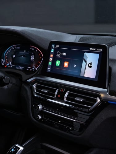 Close-up of a modern high-resolution touchscreen running wireless Apple CarPlay inside a dark BMW F30 cabin, glowing screen light on the dashboard, sharp premium automotive photography, 35mm