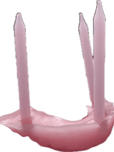 wax sculpture of teeth and birthday candles