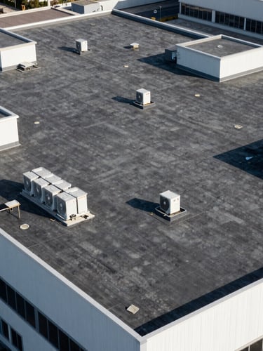 Drone-view of a large, clean commercial flat roof with HVAC units, crisp architectural photography, bright natural daylight, high-contrast deep charcoal tones, sharp focus, 35mm