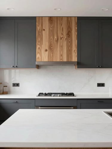 Straight-on architectural shot of a modern kitchen with custom charcoal cabinets, warm oak accents, and pristine white quartz countertops flooded with natural light, 35mm lens