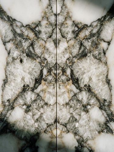 Extreme macro close-up of book-matched Calacatta marble veins, high-contrast side lighting highlighting crystalline texture, architectural focus, 35mm