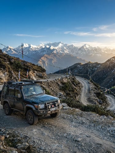 A rugged all-wheel-drive SUV parked on a winding mountain pass in Sikkim, crisp morning light hitting the snow-capped Himalayan peaks in the background, 35mm.