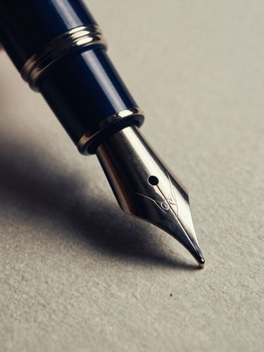 Macro close-up of a fountain pen nib gliding over heavy textured ivory paper, dramatic low-key side-lighting, deep navy shadows, high-contrast elegant editorial photography