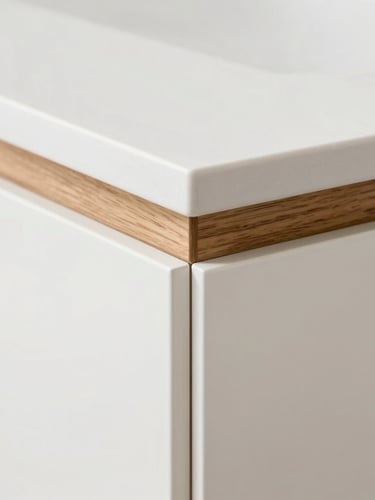 Close-up macro detail of a seamless cabinet joint, showcasing the junction between a warm natural oak wood veneer and a pristine matte white solid-surface counter, soft architectural studio lighting