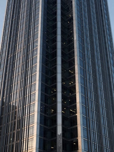 Symmetrical architectural perspective of a modern financial tower in Panama City, cool morning daylight, sharp steel and glass reflections, 35mm lens
