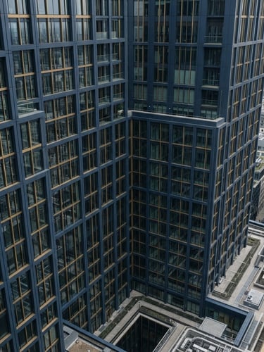 High-angle architectural perspective of a modern financial district building facade, clean geometric lines, soft overcast daylight, desaturated navy tones.