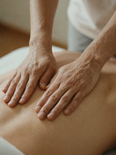 Close-up of therapeutic massage hands applying precise, gentle pressure on a back, soft warm lighting, muted earth tones, serene film grain.