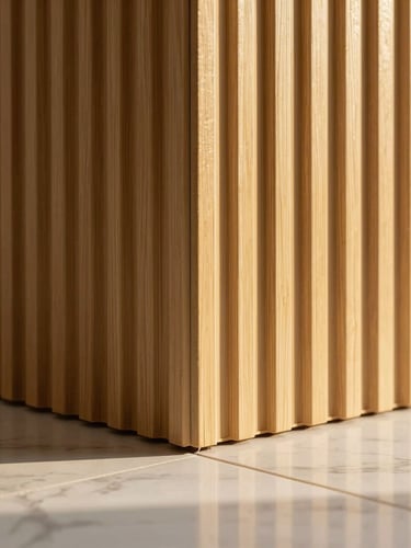 Macro detail shot of a fluted WPC wall panel junction meeting a clean marble floor, warm golden-hour light, highlighting the seamless alignment and premium material texture, 35mm