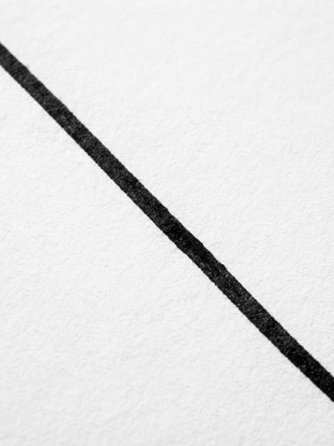 Stark minimalist macro photograph of a single black ink stroke on clean white textured paper, sharp direct studio lighting, high contrast black and white, geometric composition