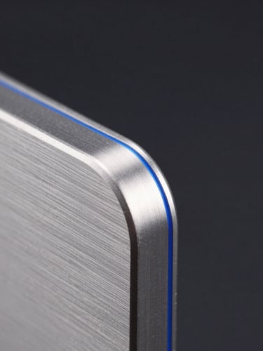 Extreme close-up macro shot of a sleek brushed titanium device edge, sharp silver highlights, deep obsidian background with subtle electric blue accent glow, clean composition.