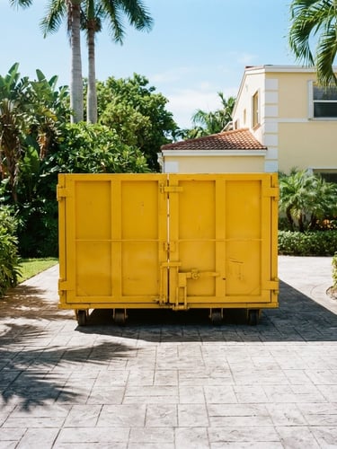 A clean, bright yellow roll-off dumpster placed neatly on a sunny Miami residential driveway, sharp focus, high-contrast shadows, 35mm