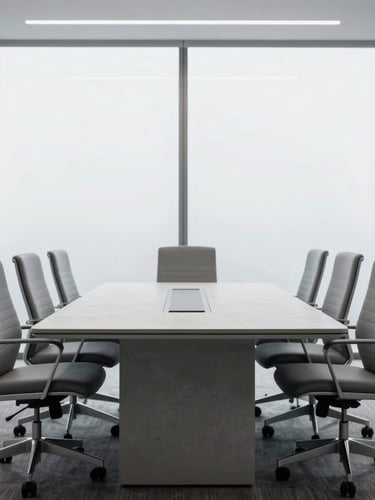 Straight-on eye-level architectural shot of a modern, empty corporate boardroom, minimalist slate-grey ergonomic chairs aligned perfectly along a concrete table, cool diffused natural light from large windows, 50mm lens.