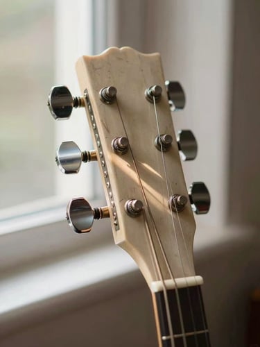 Extreme close-up of a banjo head and tuning pegs, natural north-facing window light raking across the aged drum skin and nickel hardware, shallow depth of field, warm cream tones