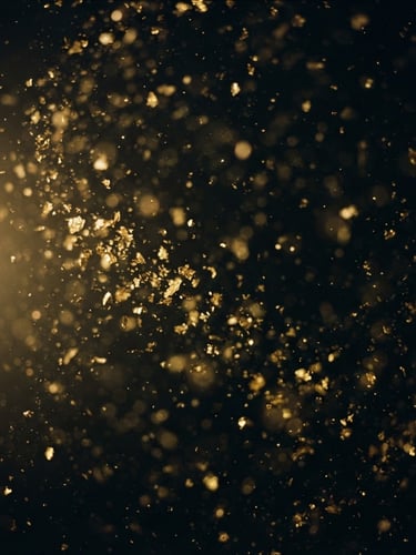 Extreme close-up macro photography of gold dust suspended in deep black water, soft focus, faint golden light leak from the left, 35mm film grain, mysterious atmosphere