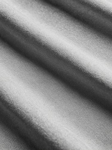 Extreme close-up of heavy 480gsm loopback cotton fabric texture, showing the intricate structural weave, high-contrast studio lighting, desaturated black and white