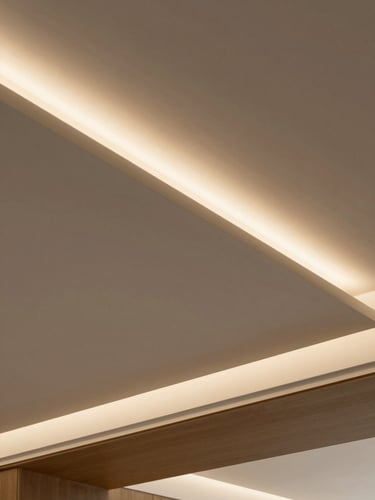 Low angle shot of a modern floating gypsum ceiling with warm integrated LED lighting, clean geometric lines, minimalist interior, architectural focus.