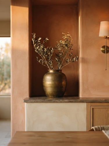 Architectural detail of a serene interior space with balanced natural light, warm terracotta and brass tones, shallow depth of field, soft golden-hour light.