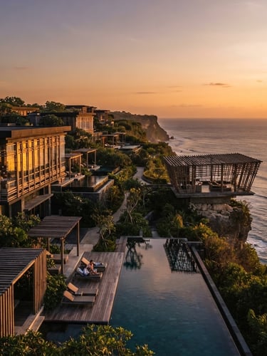 Wide environmental shot of iconic Indonesian hotel architecture, golden hour natural light reflecting off modern geometric glass and wood structures, warm editorial composition