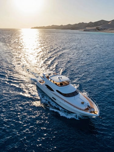 Overhead shot of a luxury yacht cruising near Dahab, golden hour light reflecting off the deep blue water, pristine coastline in the distance.