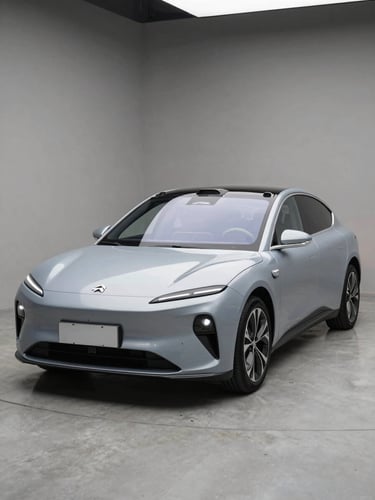 Wide three-quarter front angle of a sleek electric sedan on neutral concrete, studio strobe lighting raking across the hood, EV badge and clean wheel arch in sharp focus, no driver, no background clutter