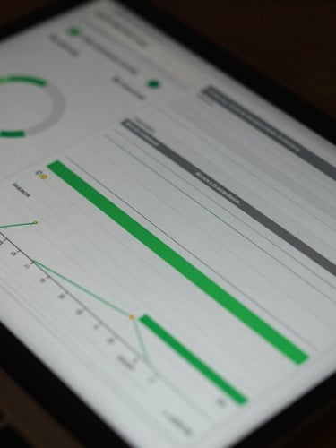 Macro close-up of a complex analytics dashboard showing multi-touch attribution models, low-key moody ambient light with sharp green screen-glare highlights.