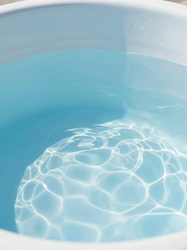 Close-up of a sparkling clean water tank interior with crystal clear water reflecting bright daylight, professional high-key lighting, clean blue and white tones
