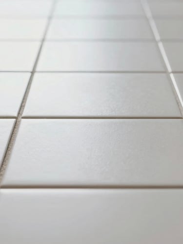 Straight-on architectural macro shot of a perfectly aligned tile installation, pristine white grout lines, bright natural daylight, clean and organized workspace.