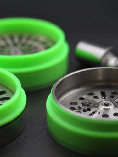 Macro shot of glass smoking accessories and clean metal grinders, neon green rim lighting, dark studio background, portrait aspect