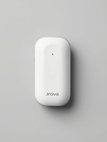 A clean flat-lay product shot of a Jrova premium consumer device on a neutral gray background under bright even studio lighting, sharp focus, high clarity.