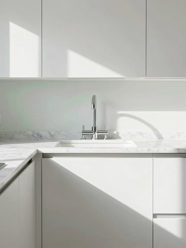 Symmetrical composition of a sunlit kitchen with empty marble countertops and gleaming fixtures, bright high-key natural daylight, sharp focus.