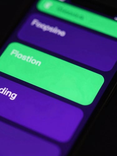 Extreme close-up of a high-resolution smartphone screen displaying fluid UI animations with vibrant neon-green and electric-violet glow, dark background, 35mm