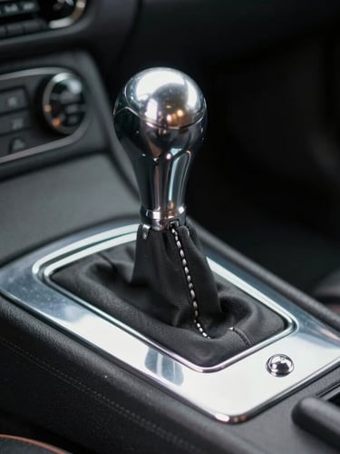 Macro studio shot of a vintage chrome gated manual shifter inside a dark Italian supercar, soft-box lighting highlighting the metallic textures and rich shadows