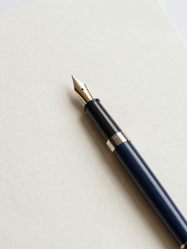 A close-up of a classic fountain pen resting on heavy, textured cream paper, soft natural daylight, minimalist composition