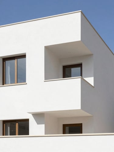 Crisp architectural photography of a bright, modern residential renovation in Spain, clean high-contrast plasterboard and painting work, natural daylight, 35mm lens