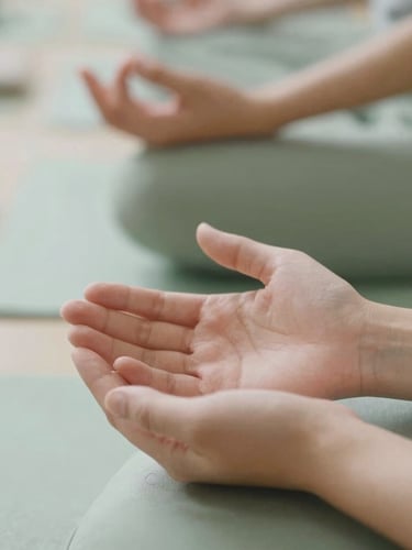 Close-up of hands during a mindful Reiki practice, soft daylight, muted sage green tones, shallow depth of field, 35mm