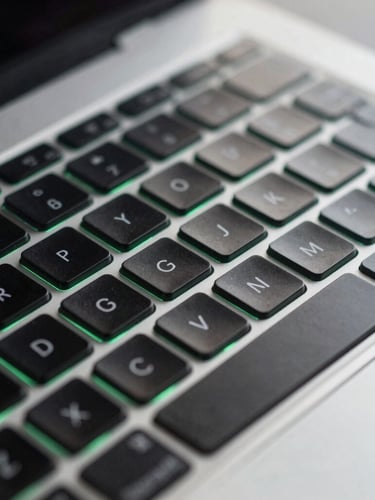 Macro shot of a sleek modern laptop keyboard with cool studio lighting and subtle emerald green ambient glow, sharp focus, 35mm