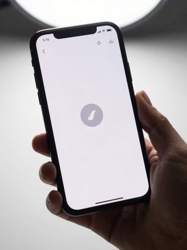 Close-up macro shot of a hand holding an Android phone, thumb hovering over a large tap target on a minimal app interface, clean white background, studio light from above, sharp focus on screen UI state