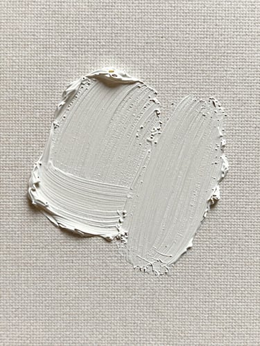 Macro close-up of textured paint strokes on linen canvas, showing heavy impasto details, bright gallery photography, neutral clean background.