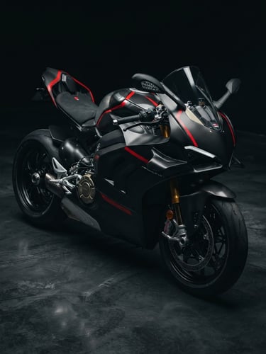 Dramatic low-key studio shot of a high-performance sport motorcycle, sharp metallic reflections, matte black carbon fiber, racing red accents, 85mm lens